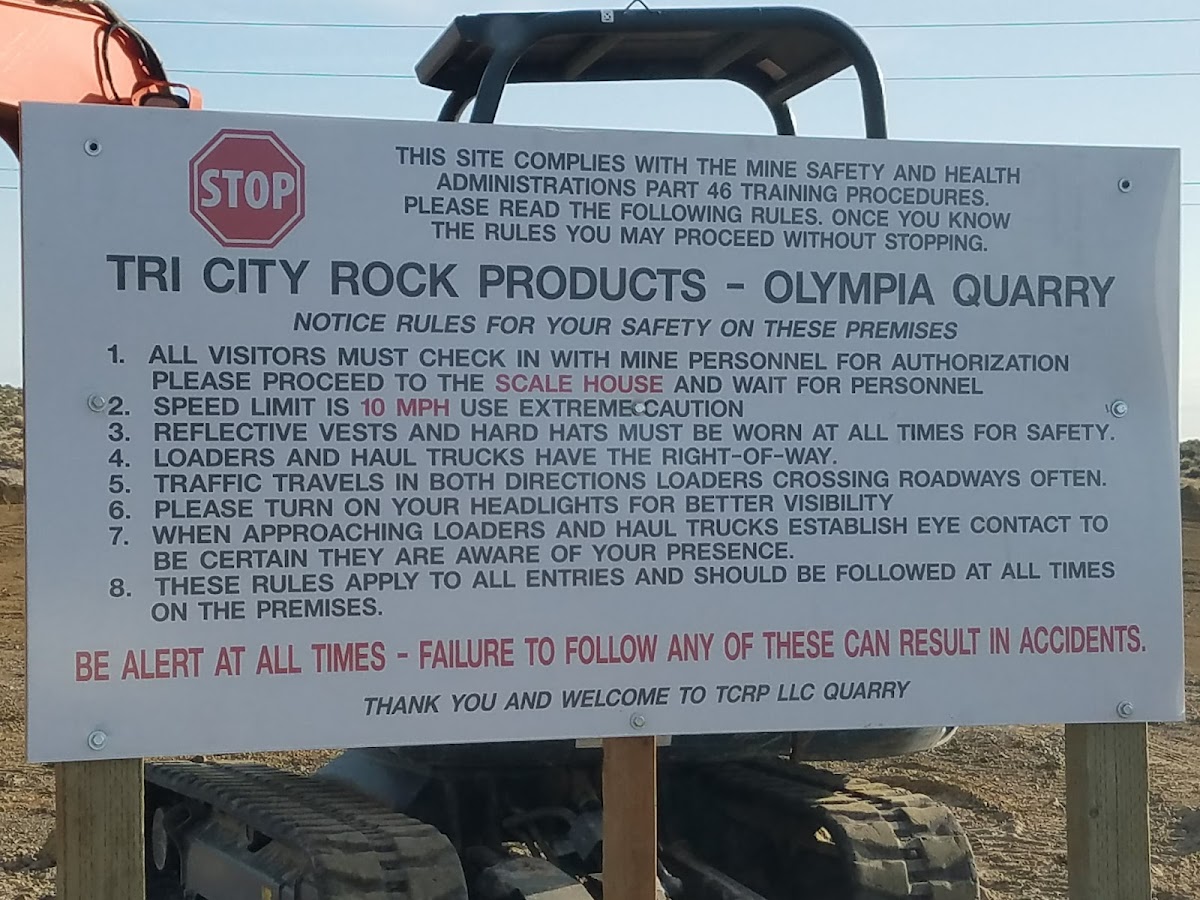 The Tri City Rock Products Olympia Quarry safety signboard at the site entrance